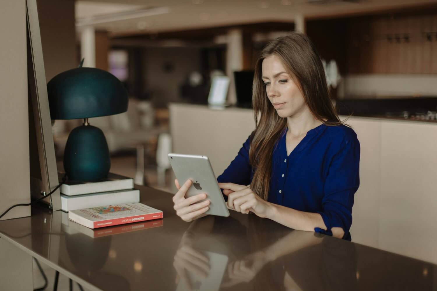 Umbrella employee on tablet checking income tax