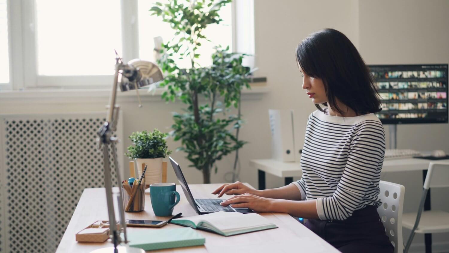 Woman on laptop checking the updates from the 2024 budget